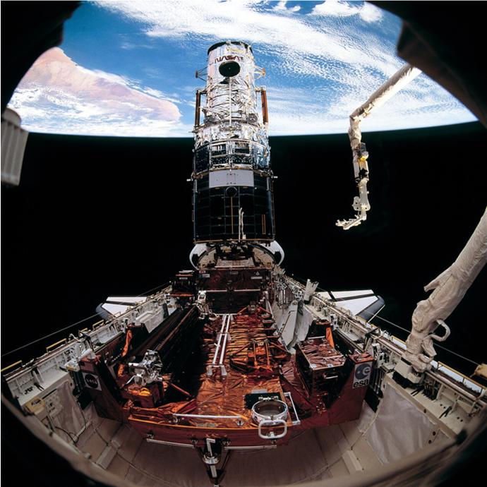 Clohessy-Wiltshire input-output model calibrated to Hubble and Endeavour STS-61 data